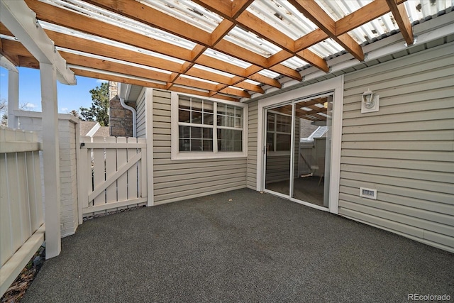 view of patio / terrace with a gate, a pergola, and fence