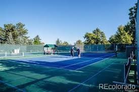 view of sport court featuring fence