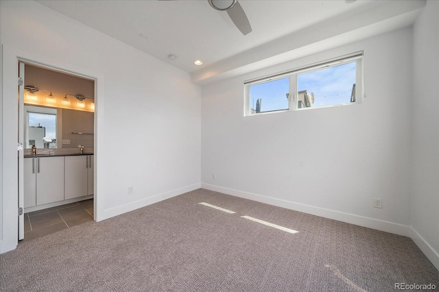 1632 Lowell Blvd Unit 5, Denver, CO 80204 - unfurnished bedroom featuring carpet flooring, ensuite bath, a ceiling fan, and recessed lighting