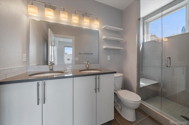 1632 Lowell Blvd Unit 5, Denver, CO 80204 - full bath with double vanity, a stall shower, and tile patterned flooring