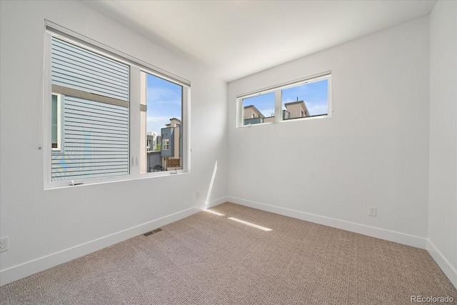1632 Lowell Blvd Unit 5, Denver, CO 80204 - carpeted empty room featuring baseboards