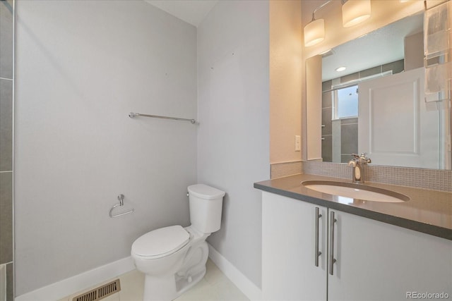 1632 Lowell Blvd Unit 5, Denver, CO 80204 - bathroom featuring vanity, tasteful backsplash, and tile patterned flooring