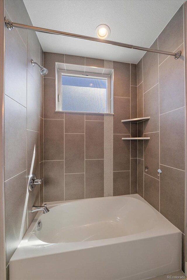 1632 Lowell Blvd Unit 5, Denver, CO 80204 - full bath featuring bathtub / shower combination and a textured ceiling