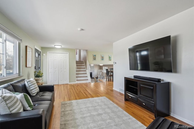 3406 E Fair Pl, Centennial, CO 80121 - living area featuring stairway and wood finished floors