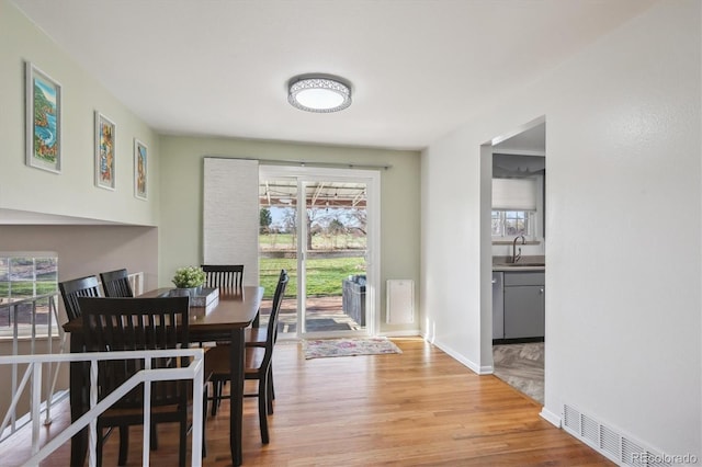 3406 E Fair Pl, Centennial, CO 80121 - dining room featuring light wood-type flooring and baseboards