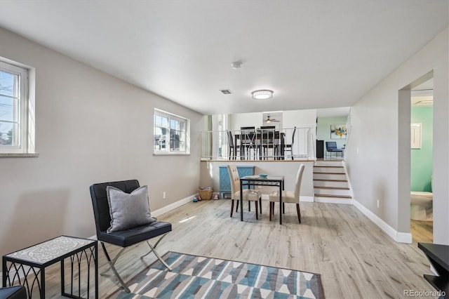 3406 E Fair Pl, Centennial, CO 80121 - dining area with plenty of natural light, light wood finished floors, and stairs