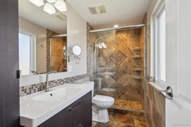 3406 E Fair Pl, Centennial, CO 80121 - bathroom with tile walls, vanity, a shower stall, and recessed lighting