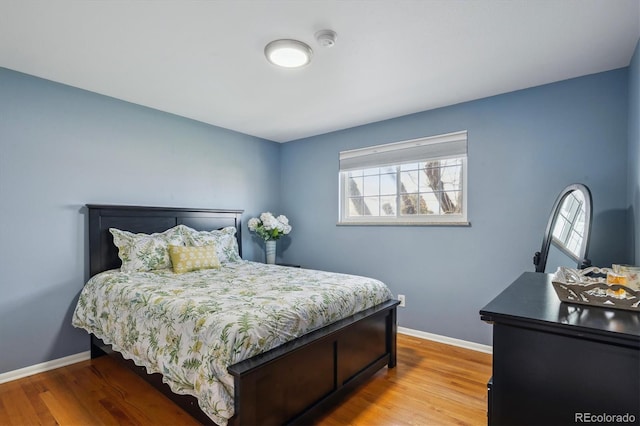 3406 E Fair Pl, Centennial, CO 80121 - bedroom featuring baseboards and wood finished floors