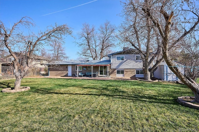 3406 E Fair Pl, Centennial, CO 80121 - rear view of house with a yard