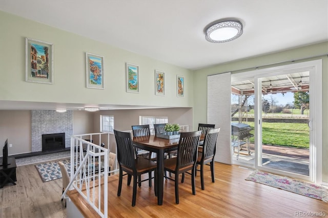 3406 E Fair Pl, Centennial, CO 80121 - dining space with wood finished floors and a brick fireplace
