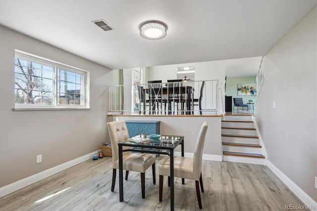 3406 E Fair Pl, Centennial, CO 80121 - dining space with wood finished floors and stairway