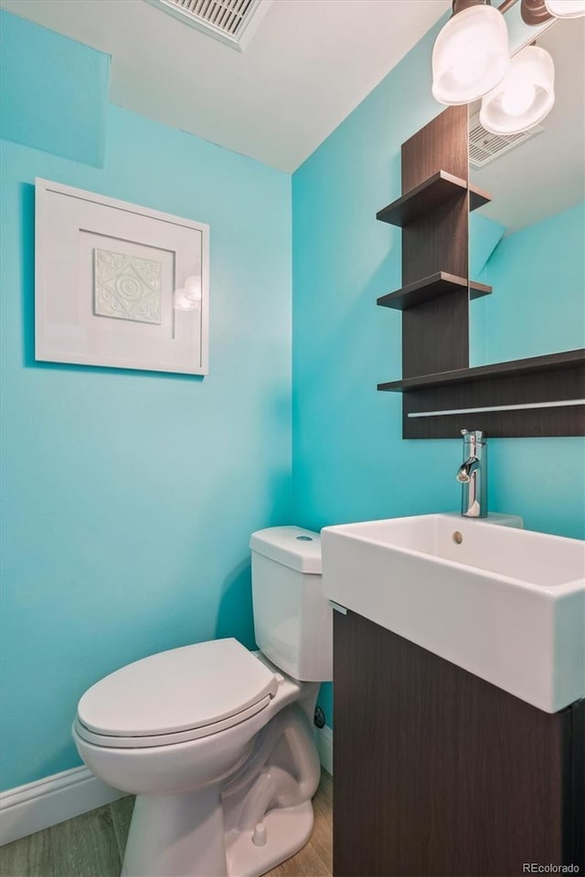 3406 E Fair Pl, Centennial, CO 80121 - bathroom with wood finished floors and vanity