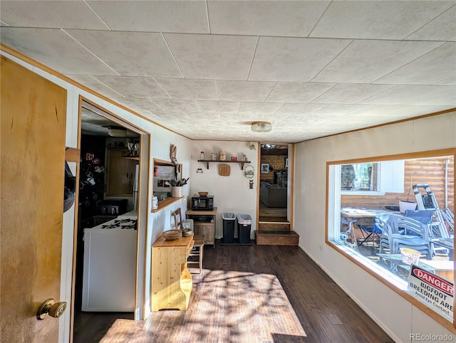 interior space with washer / dryer and dark hardwood / wood-style flooring