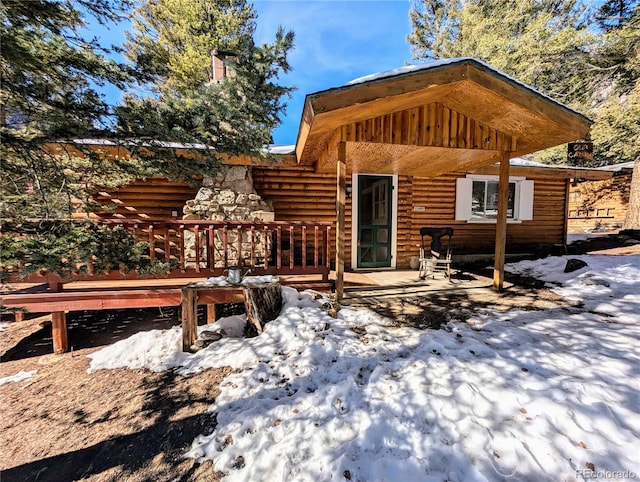 view of snow covered house