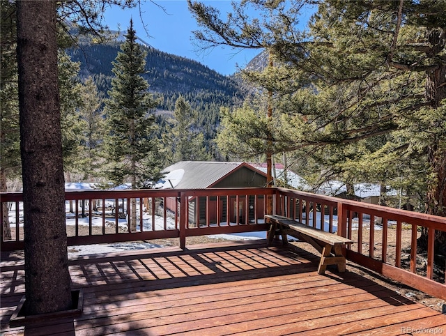 wooden deck featuring a mountain view