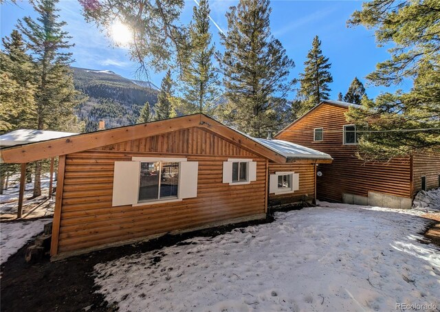 view of home's exterior featuring a mountain view