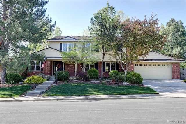 10886 E Berry Ave, Englewood, CO 80111 - traditional home featuring an attached garage, brick siding, driveway, and a front yard
