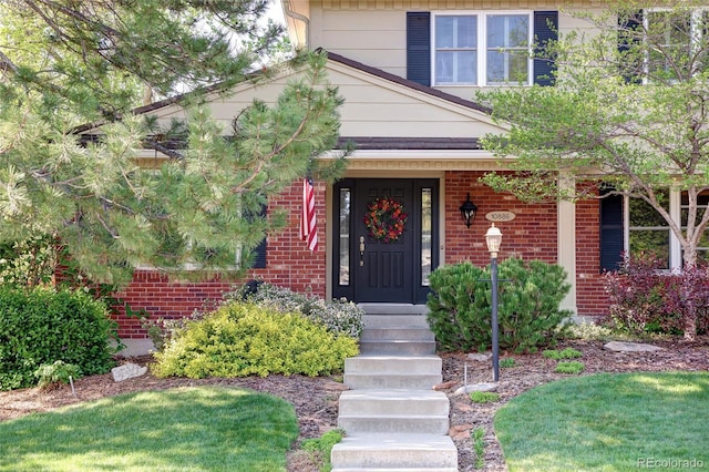 10886 E Berry Ave, Englewood, CO 80111 - doorway to property featuring brick siding
