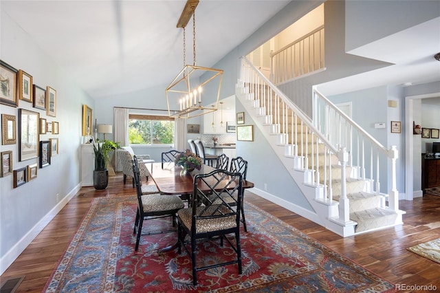 10886 E Berry Ave, Englewood, CO 80111 - dining area with stairs, dark wood-style floors, baseboards, and high vaulted ceiling