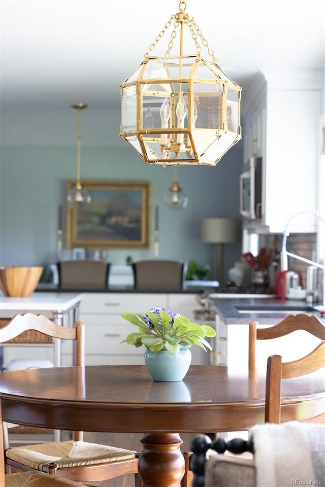 10886 E Berry Ave, Englewood, CO 80111 - dining space with a chandelier