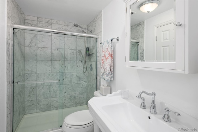 10886 E Berry Ave, Englewood, CO 80111 - bathroom featuring a sink, a stall shower, and toilet