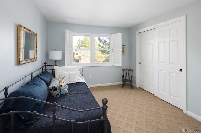10886 E Berry Ave, Englewood, CO 80111 - bedroom featuring light colored carpet, a closet, and baseboards