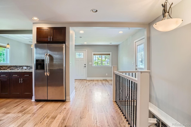 1733 S Gilpin St, Denver, CO 80210 - kitchen featuring stainless steel fridge with ice dispenser, dark brown cabinets, healthy amount of natural light, light wood-type flooring, and recessed lighting