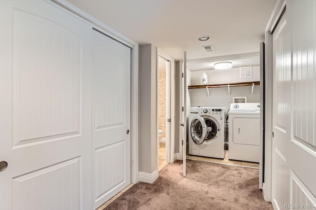 1733 S Gilpin St, Denver, CO 80210 - laundry room with washer and clothes dryer and carpet