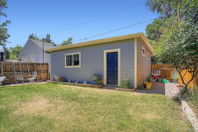 1733 S Gilpin St, Denver, CO 80210 - back of property featuring a fenced backyard and an outbuilding