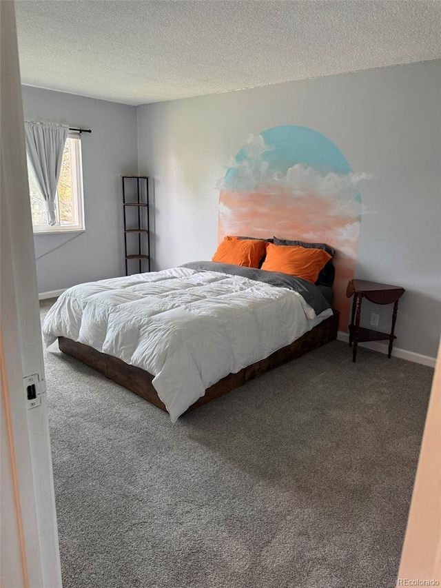 carpeted bedroom featuring a textured ceiling and baseboards