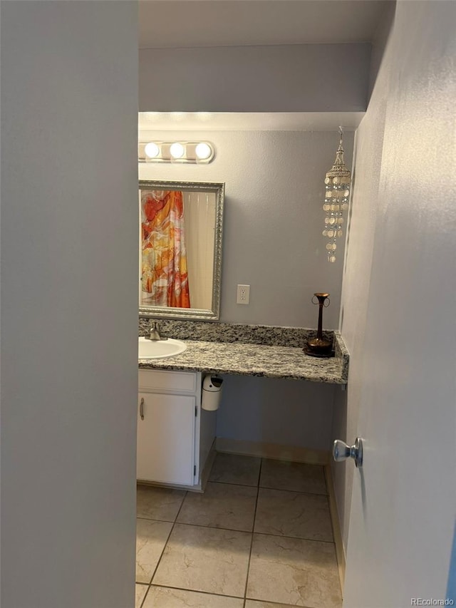 bathroom with tile patterned floors and vanity