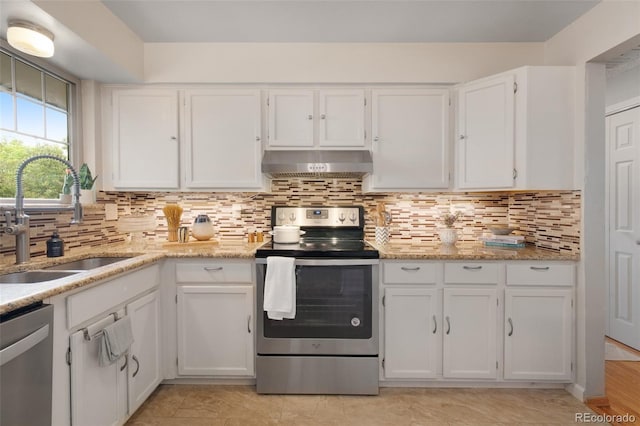 12642 E Ohio Ave, Aurora, CO 80012 - kitchen featuring stainless steel appliances, extractor fan, a sink, and white cabinetry
