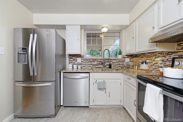 12642 E Ohio Ave, Aurora, CO 80012 - kitchen featuring appliances with stainless steel finishes, a sink, under cabinet range hood, and white cabinetry