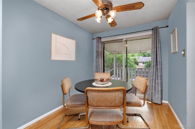 12642 E Ohio Ave, Aurora, CO 80012 - dining room with hardwood / wood-style floors, ceiling fan, a textured ceiling, and baseboards
