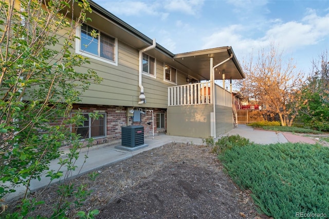 12642 E Ohio Ave, Aurora, CO 80012 - view of property exterior with central air condition unit and a patio