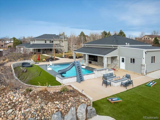 14712 Kalamath Ct, Westminster, CO 80023 - swimming pool with a patio, a lawn, and an outdoor living space with a fire pit