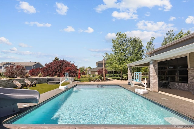 14712 Kalamath Ct, Westminster, CO 80023 - outdoor pool featuring a water slide and a patio