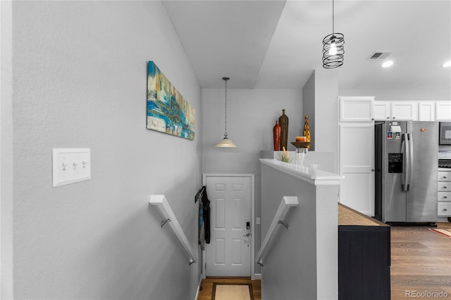 19437 E Mann Creek Dr Unit A, Parker, CO 80134 - staircase featuring wood finished floors