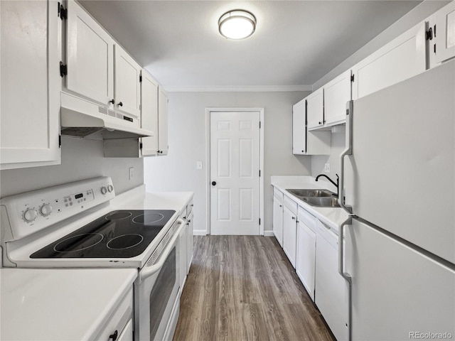 kitchen with ornamental molding, wood-type flooring, white cabinetry, sink, and white appliances