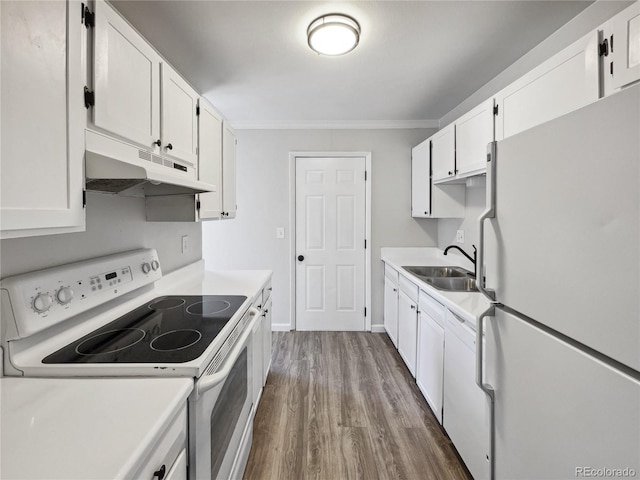 kitchen with light countertops, white appliances, white cabinetry, and under cabinet range hood