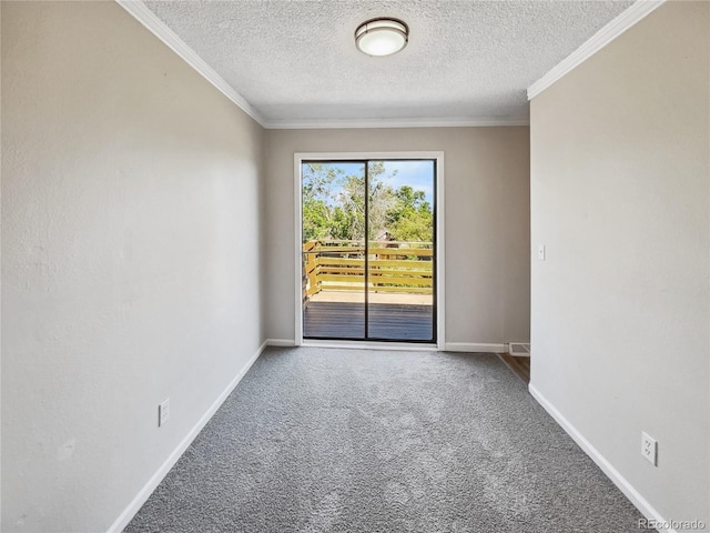 empty room featuring carpet floors, crown molding, and baseboards