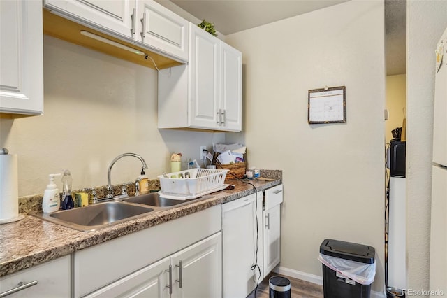 995 Holli Springs Ln, Colorado Springs, CO 80907 - kitchen featuring white cabinets, wood finished floors, and light countertops