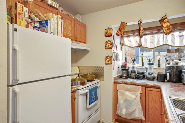 995 Holli Springs Ln, Colorado Springs, CO 80907 - kitchen with white appliances, under cabinet range hood, light countertops, brown cabinets, and backsplash