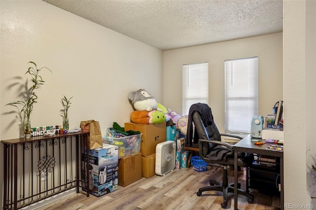 995 Holli Springs Ln, Colorado Springs, CO 80907 - office space featuring wood finished floors and a textured ceiling