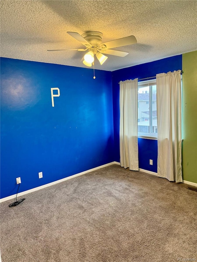 unfurnished room with carpet floors, a textured ceiling, and ceiling fan