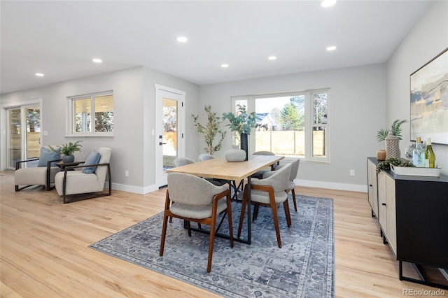 dining room featuring recessed lighting, baseboards, and light wood finished floors