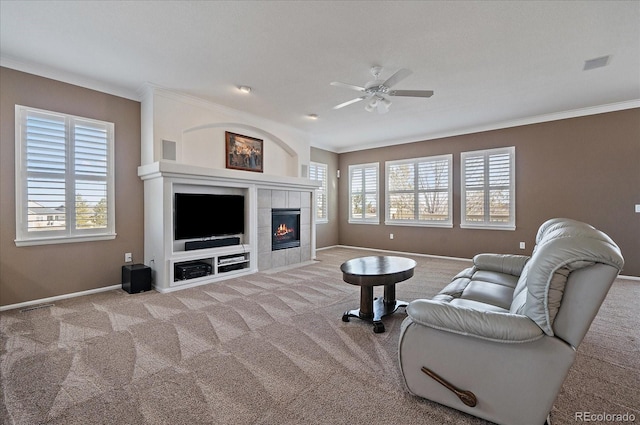 living area featuring a wealth of natural light, light carpet, and visible vents