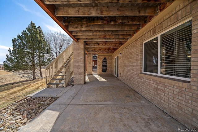 view of patio / terrace featuring stairs