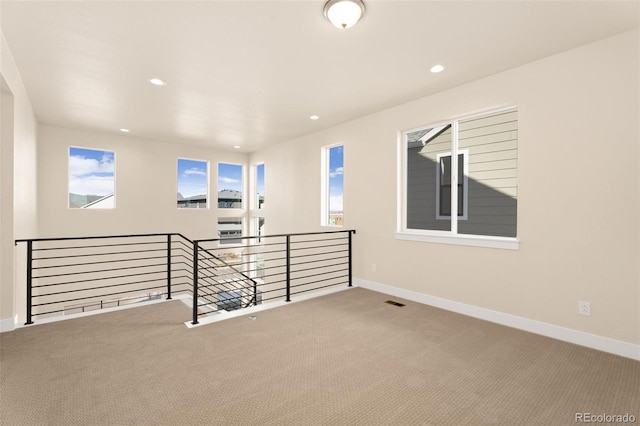 unfurnished room featuring carpet flooring