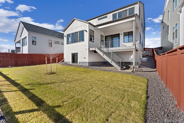 rear view of house with a lawn